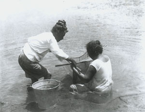 Hawaiian Woman fishing in Waimea, Kauai circa 1912